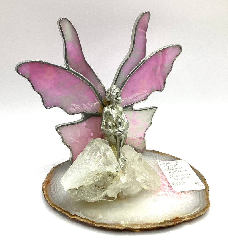 Woodland Nymph sitting on sliced Agate and Brazilian Crystals